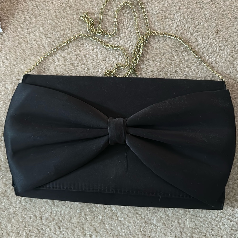 Black clutch with bow.